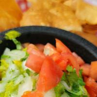 Chips & Guacamole  · Homemade corn tortilla chips with fresh made guacamole topped with pico de gallo