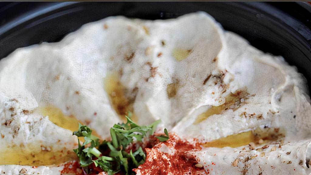 Baba Ghannoush · Oven-roasted/smoked eggplants, mashed with tahini, olive oil, lemon and fresh garlic pita.