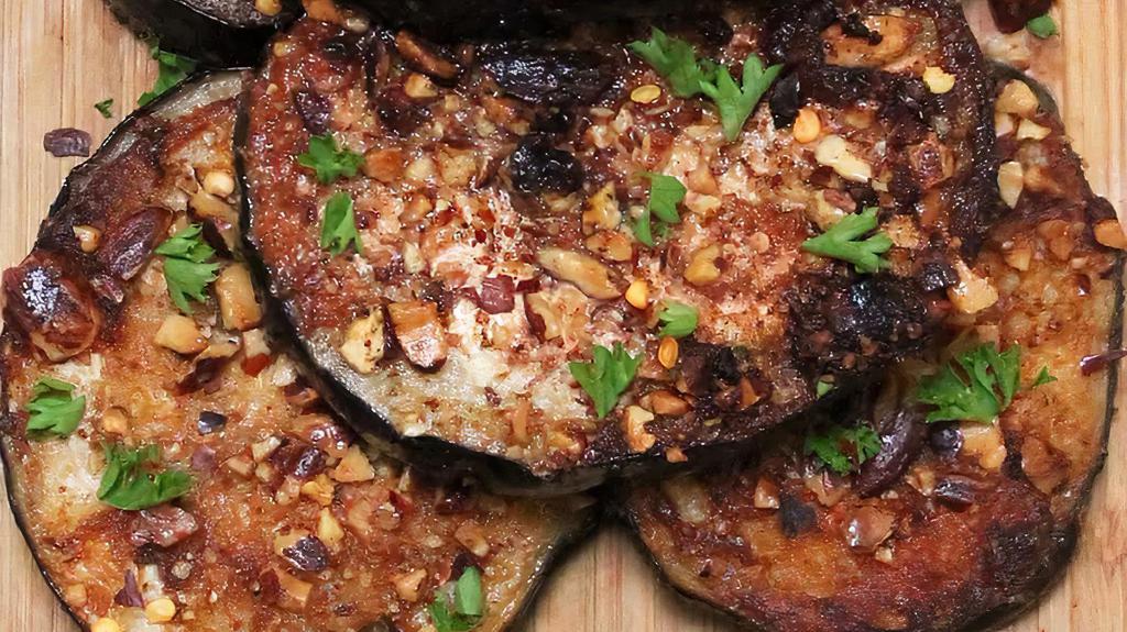 Pan-Fried Eggplants · Thinly sliced eggplants, spiced by our inspired chef and pan-fried.