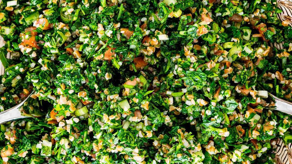 Tabbouleh Salad · Finely chopped parsley , tomatoes , mint , dry cracked wheat , olive oil , lemon and onion.