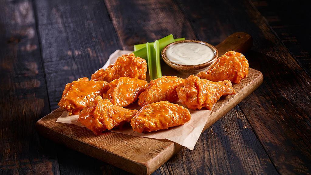 10 Bone-In Wings · Bone-in Wings tossed in your choice of sauce and served with ranch or blue cheese.