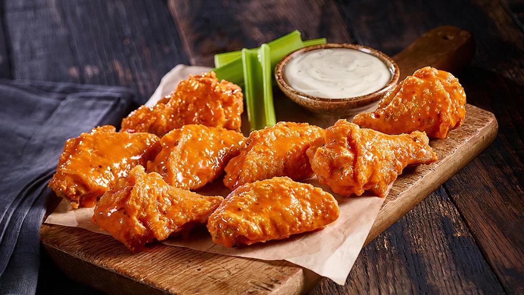 5 Bone-In Wings · Bone-in Wings tossed in your choice of sauce and served with ranch or blue cheese.