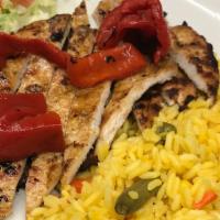 Arroz Con Pollo -L · Traditional dish of chicken, chorizo and vegetable rice, choice of grilled or shredded chick...
