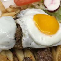 Steak & Eggs · French fries and salad.