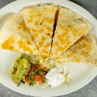 Quesadilla App · Grilled flour tortilla with cheese. Served with sour cream and guacamole with choice of shre...