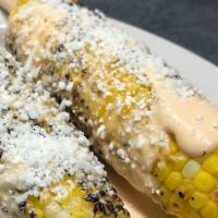 Mexican Corn-On-The-Cob (Elotes) · Grilled corn-on-the-cob (2), mexican style with chipotle mayo, cotija cheese and lime.