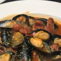 Mussels With Chorizo · In  spicy red sauce.