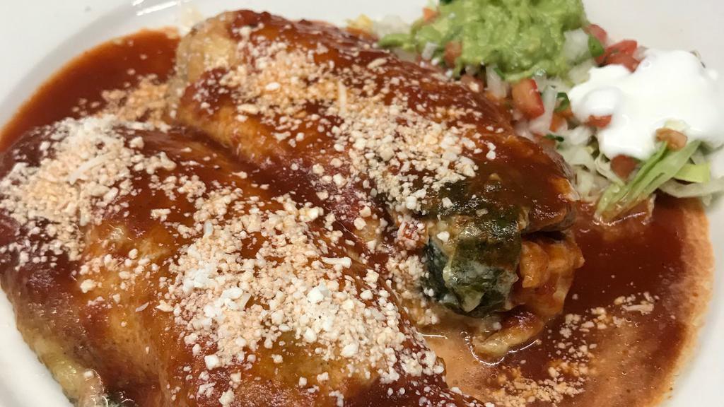 Chiles Rellenos · Battered poblano peppers stuffed with cheese and topped with ranchera sauce.