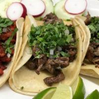 Street Tacos · A la carte. All topped with fresh onion and cilantro. Choice of carne asada (steak), chorizo...