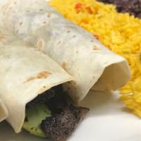 Tacos Al Carbon · Skirt steak, avocado in a flour tortilla, Served with black beans and rice.