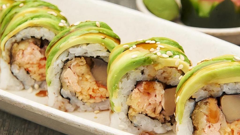 Tiger Roll · Tempura d salmon, spicy kani, portabella, and fried onion wrapped with avocado and topped with fried onion.