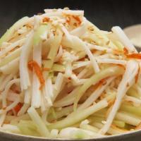 Kani Salad · Shredded kani mixed with thinly shredded cucumber tossed in a light mayo based dressing.