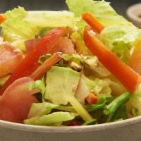 Garden Salad · Fresh lettuce, tomato, onion, pepper, carrot, layered with avocado slices. Served with a spe...
