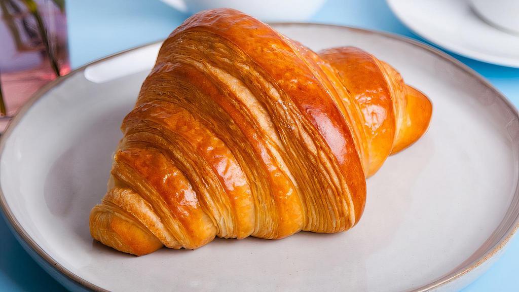 Plain Croissant · Flaky, buttery croissant.