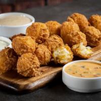 Cheddar Tots Trilogy · Served with Sriracha ranch, horseradish sour cream, Sammie’s signature sauce.