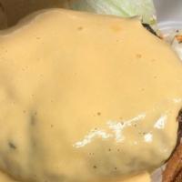 Wisconsin Cheddar Burger · Topped with our homemade cheddar cheese sauce