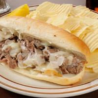 Philly Cheesesteak · Chicken or steak, with grilled onions, peppers and melted American cheese.