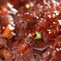 Baby Back Ribs · Basted with BBQ sauce and served with your choice of starch or vegetable.