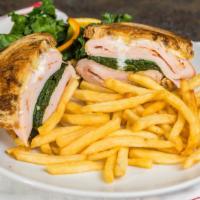 Mama'S Turkey Sandwich · Thinly sliced boar's head oven gold turkey, sauteed spinach, and muenster cheese on grilled ...
