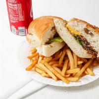 Steak Sandwich · With French fries and can of soda.