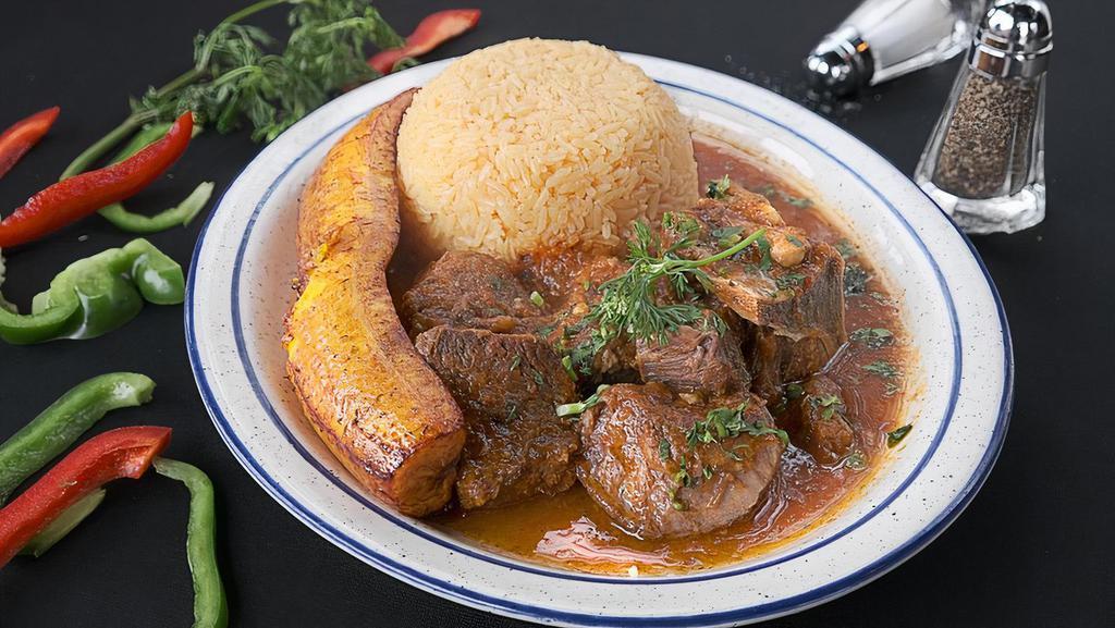 Seco De Chivo (Arroz Y Maduro Frito) · Goat stew  with rice and fried sweet plantain