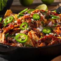Roasted Bbq Pulled Chicken Nachos · Roasted BBQ Pulled Chicken Served with Tortilla Chips, Jack & Cheddar Cheeses, Black Beans, ...