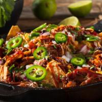 Roasted Pulled Chicken Nachos · Roasted Pulled Chicken Served with Tortilla Chips, Jack & Cheddar Cheeses, Black Beans, Pico...