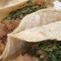 Tacos Mexicanos · Three corn tortilla topped with grill steak, chicken, chorizo, or carnitas, onions, and cila...