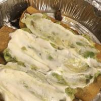 Flautas · Two corn tortillas with beef or chicken topped with sour cream and guacamole.