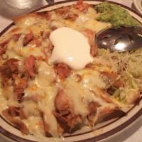 Super Nachos · Tortilla chips, cover with cheese, bean, choice of beef, chicken or chile con carne top with...