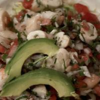Ceviche Chapala · Shrimp and octopus marinated in fresh lime juice and olive oil with tomato, cilantro and oni...