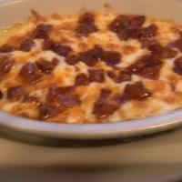 Queso Fundido Con Chorizo · Melted cheese with mexican sausage served with flour tortillas.