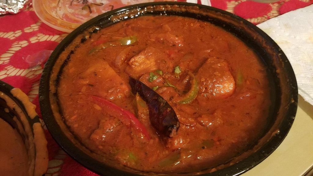 Chicken Jalfrezi · Chicken cooked in medium spiced tomato curry with stir-fried onions, bell pepper and tomatoes.