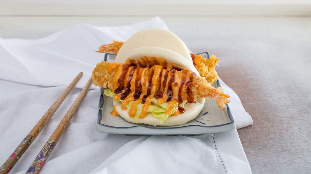 Shrimp Bun · Most popular.Two pieces. Steamed bun with tempura shrimp, lettuce, spicy mayo, and okonomi sauce.
