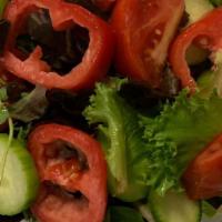 Ensalada De Casa · House Salad – Mixed greens, tomatoes, cucumbers, onions with an oil & vinegar dressing