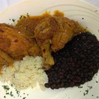Pollo Guisado · Pieces of chicken (bone-in) stewed in red sauce, vegetables, and potatoes; served with rice ...