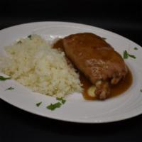 Chuleta Rellena · Rack of pork chop, pounded and stuffed with mozzarella and provolone cheese, finished in bro...
