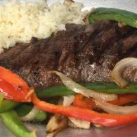 Churrasco · Grilled steak served w/ peppers, onions, and rice