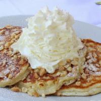 Buttermilk Pancakes · Seasonal berries and fruits, whipped cream, choice of syrup; maple, coconut, blueberry, boys...