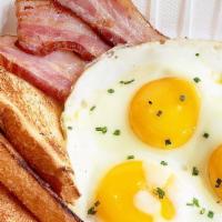 Thick Cut Bacon And Eggs · Local Hawaiian honey glazed thick cut bacon, local honey, two eggs, toast, rosemary potatoes
