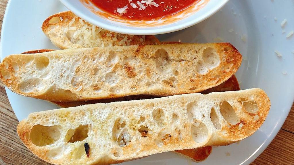 Garlic Bread 4Pc · house bread, garlic & herb butter, Parmigiano Reggiano, Pomodoro sauce