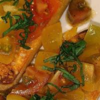Bruschetta · Toasted Focaccia, tomatoes, olive oil, vinegar pamesian flakes