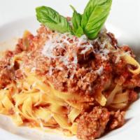 Bolognese · Fresh Tagliatelle Pasta, Veal,
Pork & Beef, Tomato sauce
