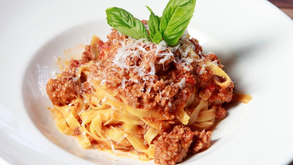 Bolognese · Fresh Tagliatelle Pasta, Veal,
Pork & Beef, Tomato sauce