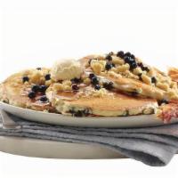 New! Blueberry Muffin-Top Pancakes · Get 3 fluffy pancakes filled with plump, wild blueberries, topped with our house made crumb ...