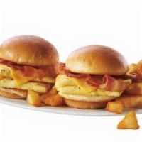 New! Breakfast Sliders · Sandwich your appetite between 2 mini Brioche buns filled with a hearty portion of scrambled...