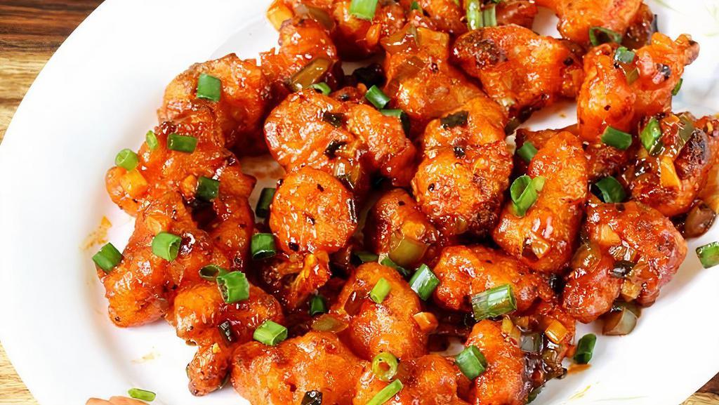 Gobi Manchurian Veg · Gobi Manchurian is a popular Indo Chinese appetizer made with fried cauliflower coated in corn flour cooked in spicy, sweet ,tangy, soya sauce and  vinegar,