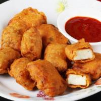 Paneer Pakora · Paneer pakora is a deep fried popular north Indian snack with a crispy outer layer of gram f...