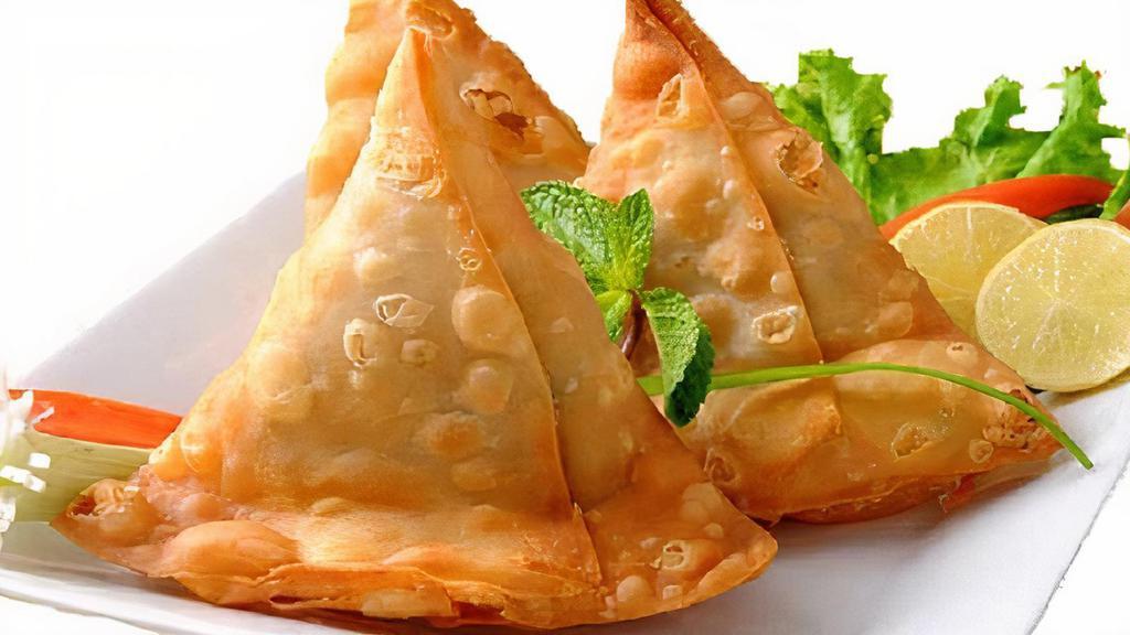 Samosa Veg · A samosa is a fried or baked pastry with a savoury filling, such as spiced potatoes, onions, peas Samosas are deep-fried to a golden brown color in vegetable oil.