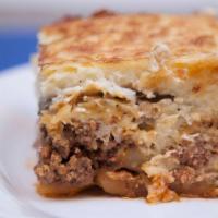 Moussakas · Traditional Greek Casserole with Bechamel Sauce,
Ground Beef, Eggplant & Potatoes